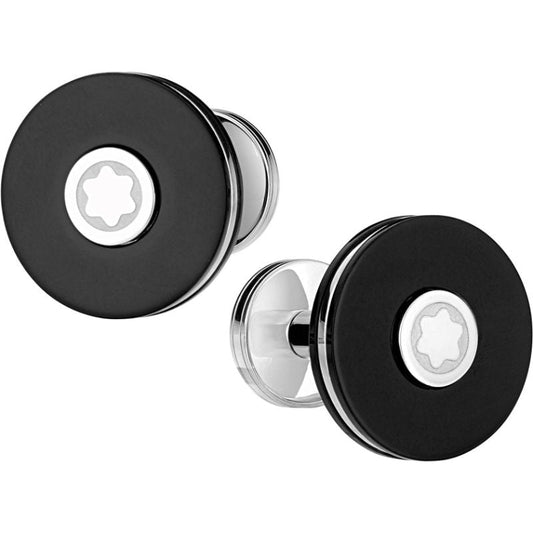 The Montblanc PIX Cufflinks feature a sleek and modern design with a round shape and black resin. They are crafted from stainless steel and adorned with a silver-tone emblem displaying a star design in the center, all set against a white background.