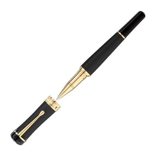The Montblanc Pen Bonheur Nuit Rollerball Pen exudes sophistication with its sleek black and gold design, featuring a shiny finish and the cap positioned to the left. Its elegant style is perfect for those who appreciate timeless grace, highlighted by its radiant golden accents.