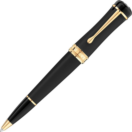 The Montblanc Bonheur Nuit Ballpoint Pen is a sophisticated writing instrument with a sleek design, featuring yellow gold-coated details and a wide barrel. Its black body is complemented by a luxurious clip and decorative band near the tip, epitomizing elegance and refinement.