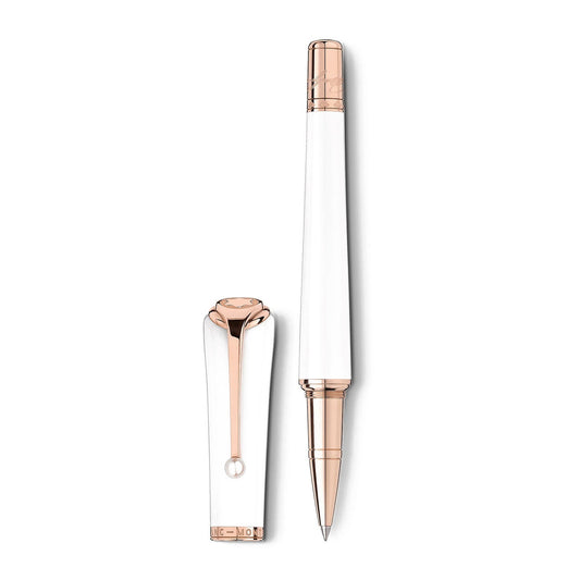 The Montblanc Muses Marilyn Monroe Special Edition Pearl Rollerball Pen, with its elegant white design and rose gold accents, exudes femininity as it rests next to its matching cap on a plain white background. The pen boasts a pointed tip, while the cap is adorned with a rose gold clip that echoes Marilyn Monroe's timeless elegance.