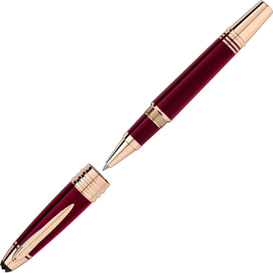 Discover the Montblanc Great Characters John F. Kennedy Special Edition Rollerball Pen, an exquisite writing instrument in red and gold hues. With the cap removed, its sleek design unveils a polished body adorned with gold accents, epitomizing Montblanc's renowned elegance and crafted from high-quality materials.