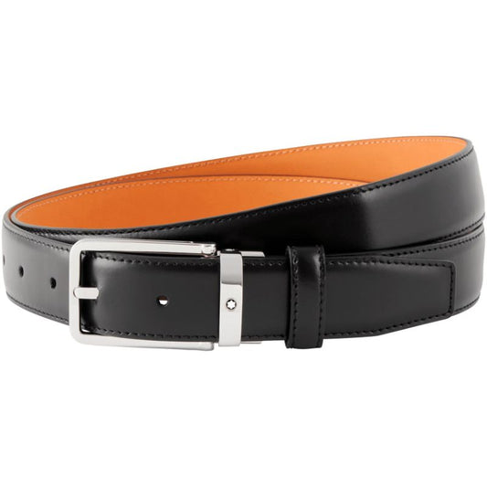 Displaying a Montblanc Business Leather Belt, the black exterior with a silver buckle showcases its elegant design, while the tan interior adds a touch of contrast. It is coiled in a circular shape.