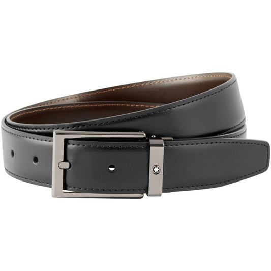 Introducing the Montblanc Reversible Leather Belt, a sophisticated accessory crafted from black leather with a polished finish. This sleek design includes a ruthenium-coated buckle and offers multiple adjustment holes. Perfectly packaged in a neatly rolled fashion against a white background, it's an elegant addition to any wardrobe.