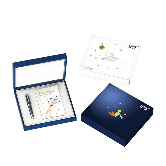 The Montblanc Meisterstück Le Petit Prince Happy Holiday Fountain Pen Set embodies the playful charm of Le Petit Prince, featuring a blue piston fountain pen decorated with an 18K champagne gold-coated nib and accents. The set includes two decorative boxes—one with star and fox motifs and the other showcasing a whimsical Little Prince illustration.