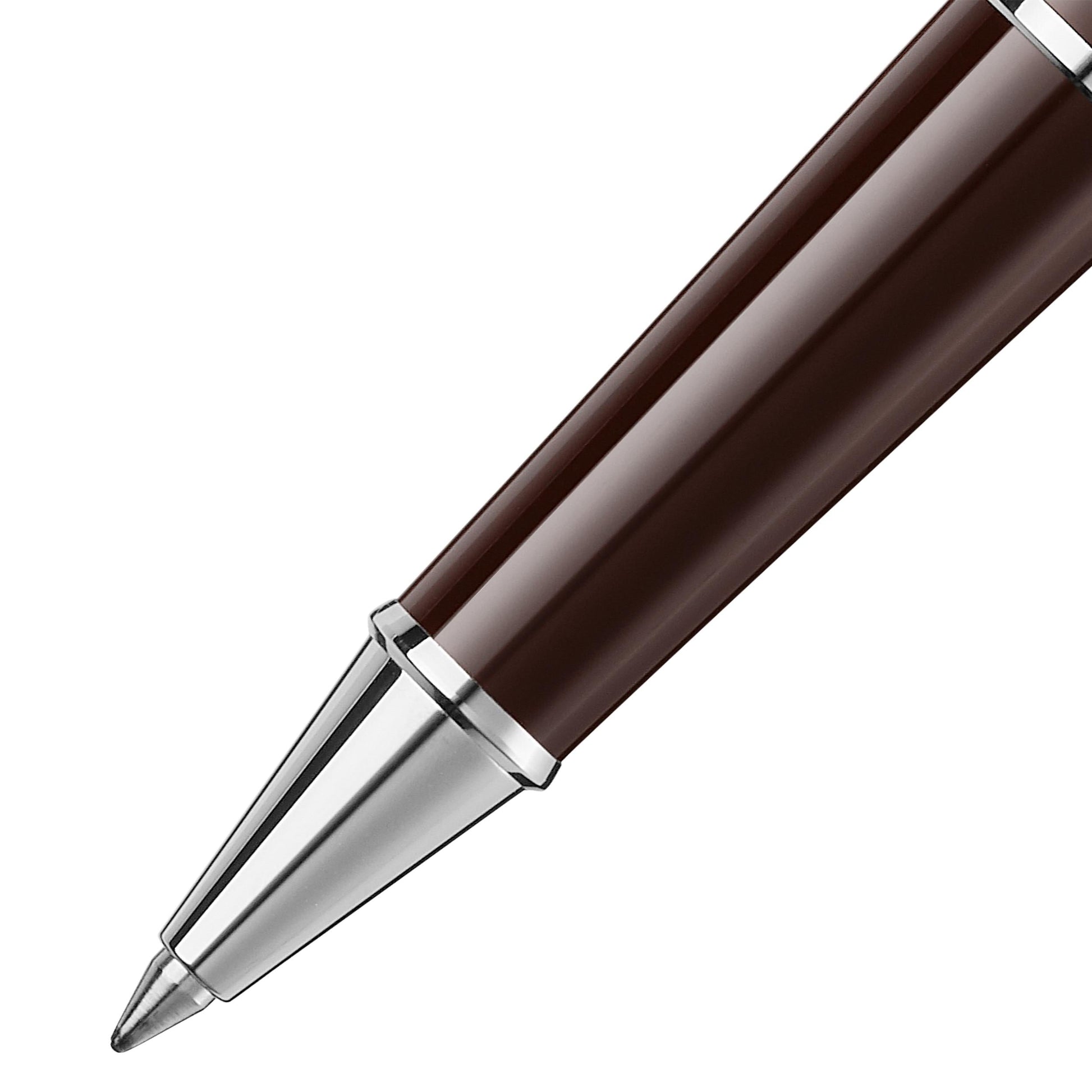Showcasing a sophisticated Montblanc Meisterstück Le Petit Prince Classique Rollerball pen, its Aviator Brown barrel creates a stunning contrast with the gleaming silver tip against a pristine white backdrop.