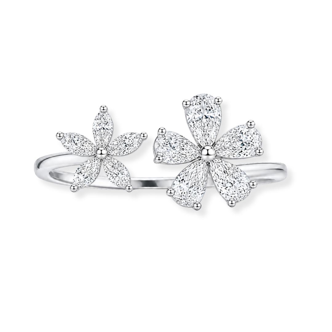 Introducing the Raffi&Co.® 18K White Gold Diamond Fashion Ring: a stunning silver ring adorned with two floral motifs, each featuring marquise-shaped petals accented by small SI-VS diamonds in various shapes totaling 1.29 CTW, beautifully displayed against a plain white background.