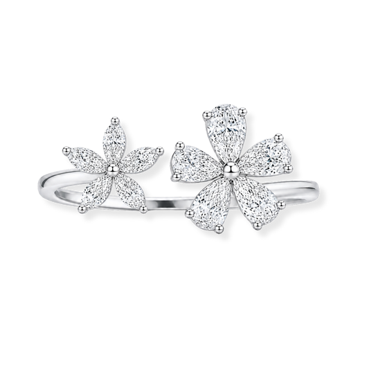 Introducing the Raffi&Co.® 18K White Gold Diamond Fashion Ring: a stunning silver ring adorned with two floral motifs, each featuring marquise-shaped petals accented by small SI-VS diamonds in various shapes totaling 1.29 CTW, beautifully displayed against a plain white background.