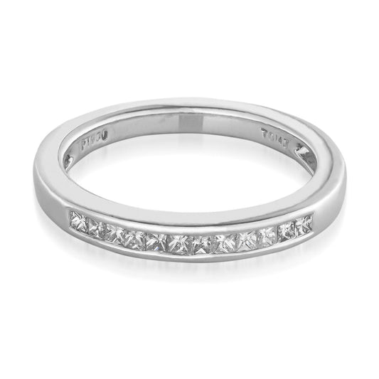 The Raffi&Co.® Platinum Princess Cut Diamond Anniversary Ring showcases a row of square diamonds with VS1-VS2 clarity, elegantly set in a channel along the top. This sleek design is enhanced by engravings inside the band, creating a timeless piece.