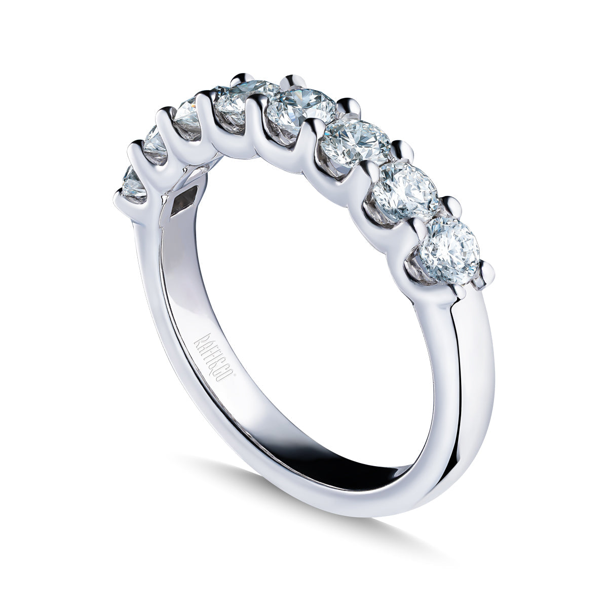 The Raffi&Co.® 14K White Gold Round Brilliant Diamond Anniversary Ring showcases a row of seven round brilliant diamonds in prong settings, elegantly displayed on a white background.