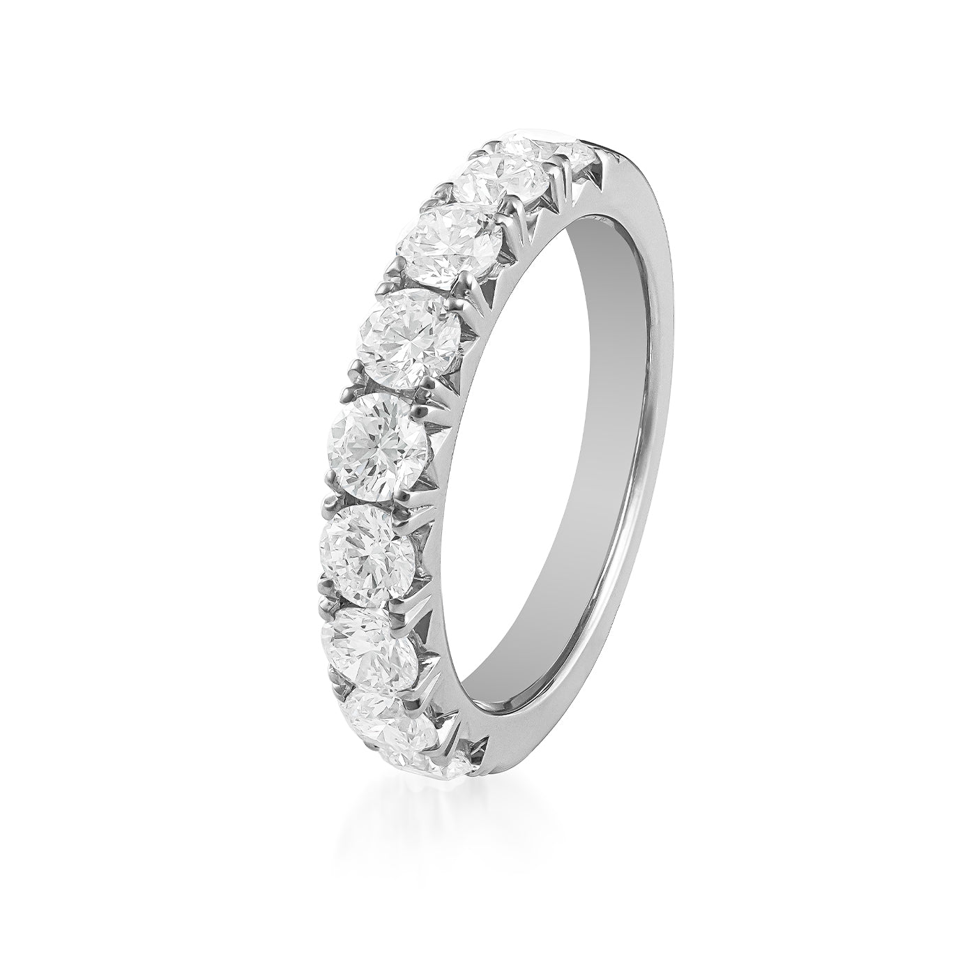 The Raffi&Co.® 18K White Gold Round Brilliant Diamond Anniversary Ring is a breathtaking piece, featuring brilliant diamonds set in a symmetrical band design. The 18K white gold ring is elegantly elevated, highlighting its detailed craftsmanship and the clarity of the gemstones against a plain white background.