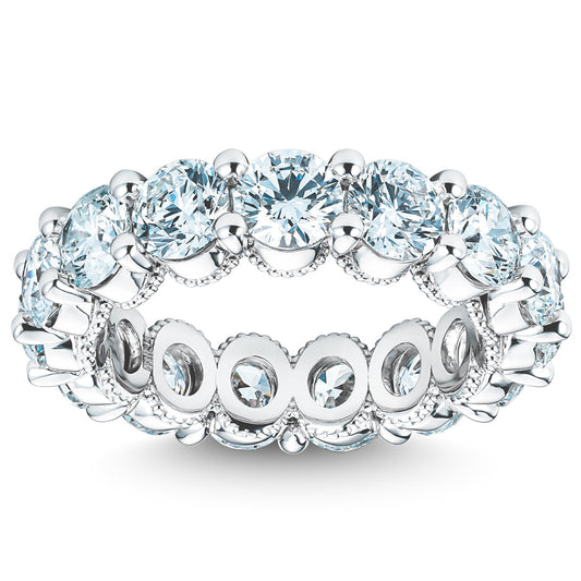 The Raffi&Co.® Signature 14K White Gold Round Brilliant Diamond Anniversary Ring showcases intricate detailing with large, round-cut diamonds around the band, offering a reflective sparkle.