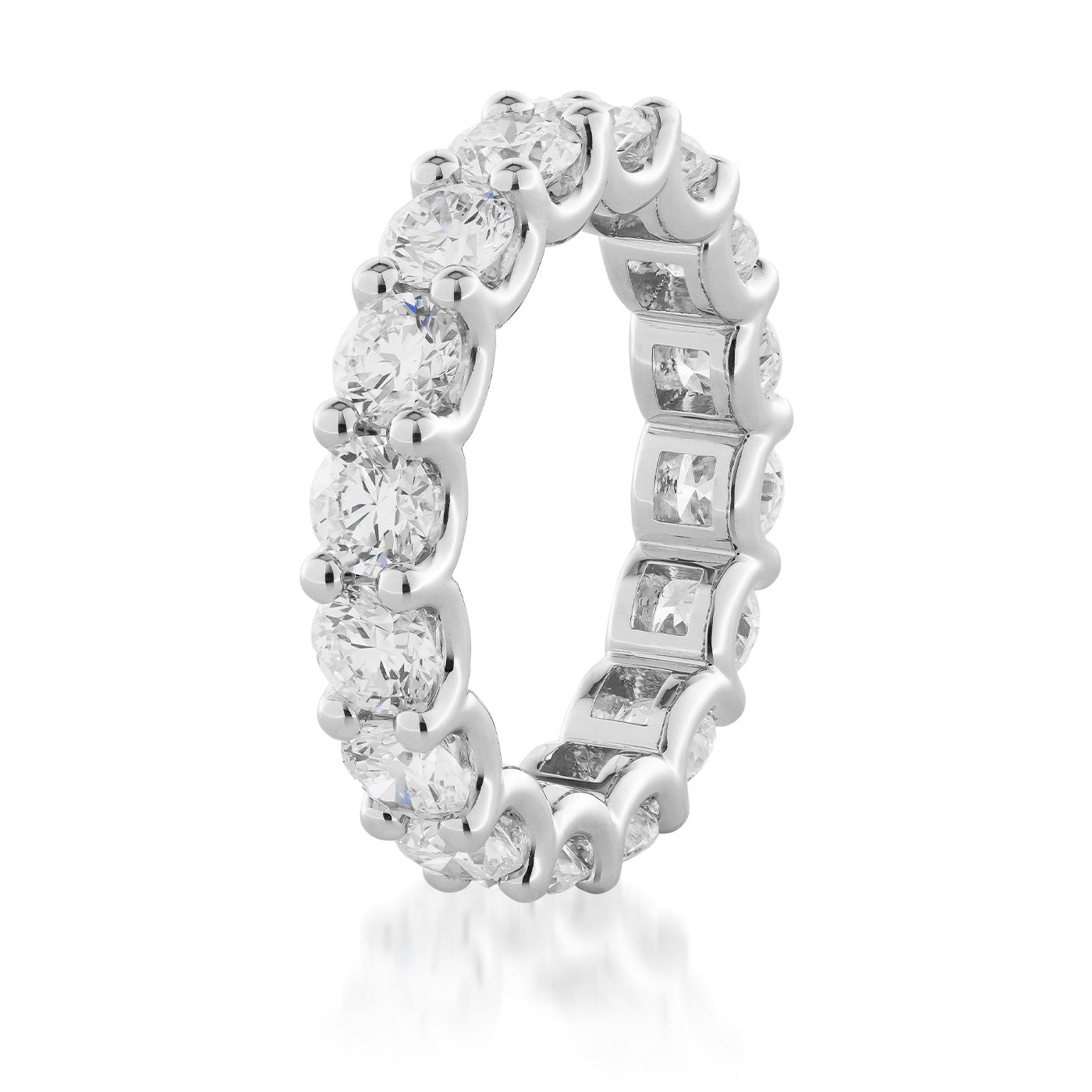 The Raffi&Co.® 14K White Gold Round Brilliant Diamond Eternity Ring features an exquisite array of large round-cut lab diamonds set along the entire band. Against a simple white backdrop, it dazzles with breathtaking light, making it the ideal anniversary ring.