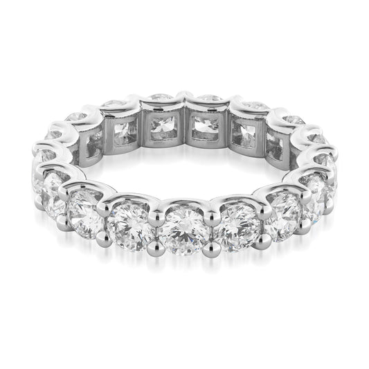 Introducing the Raffi&Co.® 14K White Gold Round Brilliant Lab Diamond Eternity Ring, a breathtaking silver eternity band by Raffi&Co. Exquisitely crafted from 14K white gold, this ring features a seamless circle of round brilliant lab diamonds set in prongs against a pristine white background. Ideal as an anniversary ring, it radiates elegance and timeless beauty.