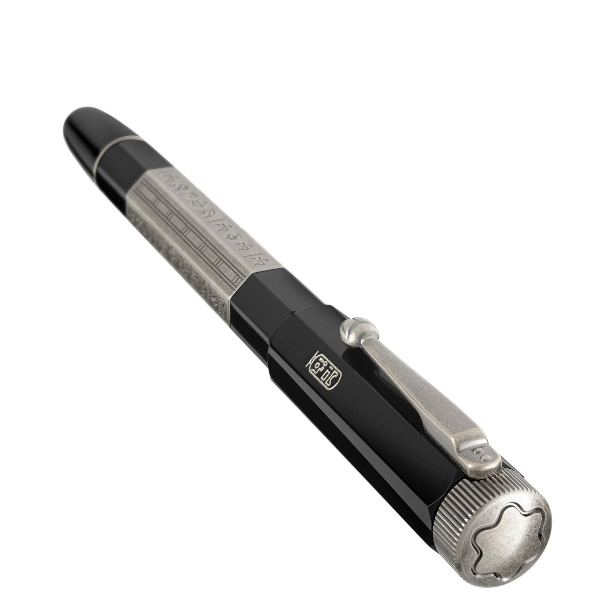 The Montblanc Heritage Egyptomania Doue Rollerball Pen by Montblanc is a luxurious writing instrument showcased in black and silver. It boasts intricate details on its barrel and a decorative clip, while the cap is adorned with an emblem, presenting a sleek and elegant design inspired by Egyptomania.