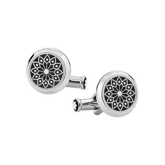 Montblanc's Homage to Victor Hugo Stainless Steel Cufflinks feature a round design with an intricate black geometric floral pattern at the center, framed by sleek, shiny silver edges.