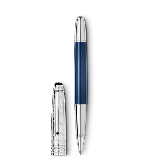 A Montblanc Meisterstück Around the World in 80 Days Doué Classique Rollerball Pen crafted in blue resin and silver with a detailed patterned silver cap resting beside it, all set against a plain white background.