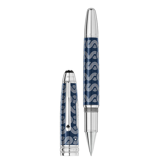 The Montblanc Meisterstuck Around the World in 80 Days Solitaire LeGrand Rollerball is a luxurious writing instrument featuring a detachable cap. It boasts a stunning blue resin and silver wave pattern design, with both the pen and its cap adorned with shiny metallic accents for an elegant finish. Displayed upright next to its cap, this exquisite pen showcases its intricate craftsmanship.
