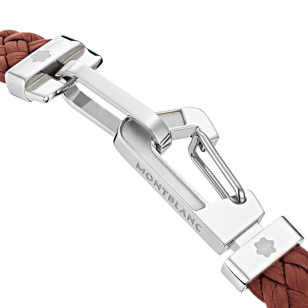 The Montblanc Wrap Me Bracelet features a close-up of a polished silver clasp adorned with the iconic Montblanc logo, attached to a braided brown leather strap. This bracelet embodies a sleek and modern design with a delicate flower emblem on its surface, radiating elegance and sophistication.