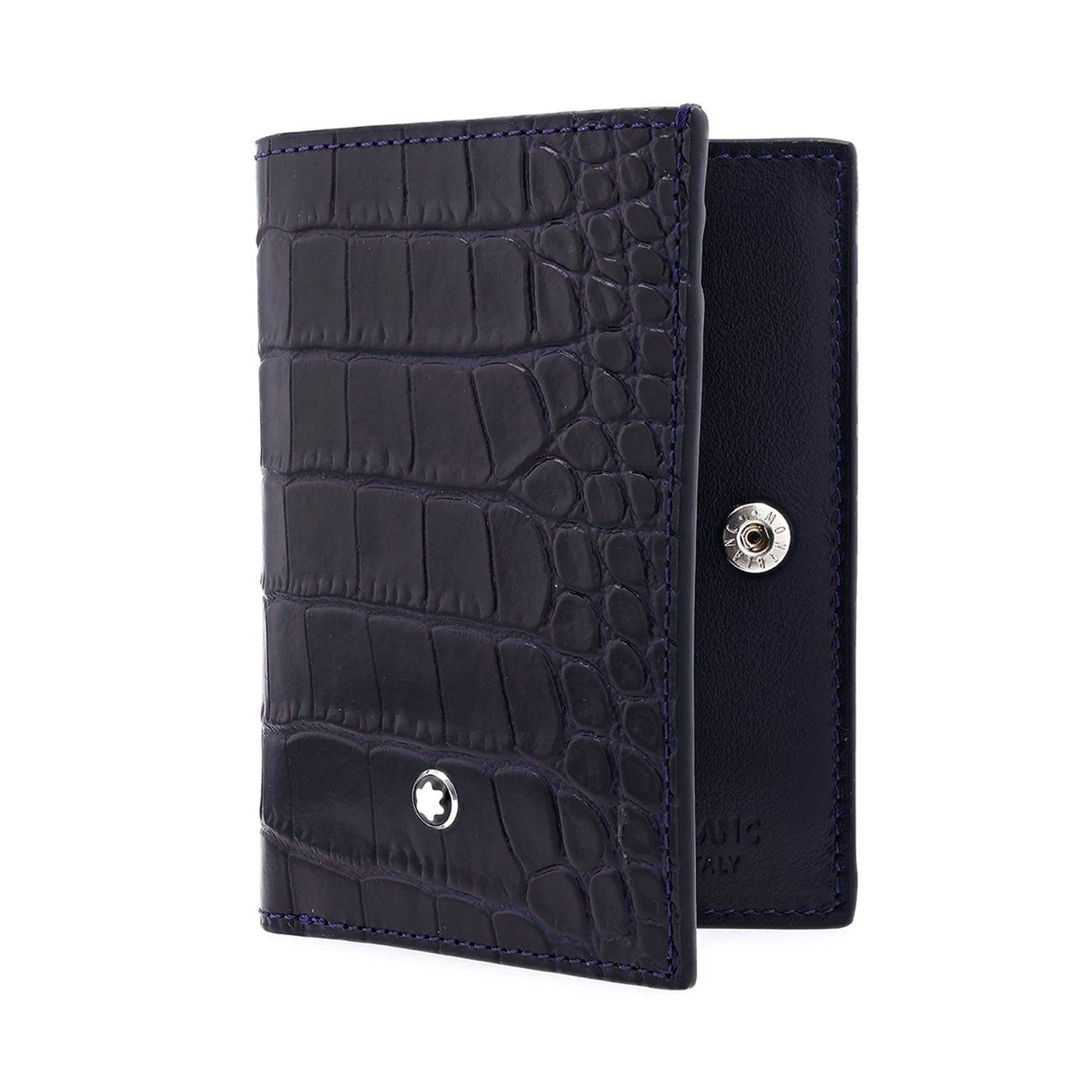 The Montblanc Meisterstuck Leather Business Card Holder is a stylish and functional accessory, featuring an elegant black leather design with a crocodile texture and a sophisticated Montblanc emblem on the front. It partially opens to reveal a snap closure, cleverly doubling as both a wallet and business card holder for any occasion.