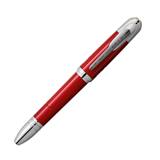 Introducing the Montblanc Great Characters Enzo Ferrari Special Edition Rollerball Pen: a sophisticated creation by Montblanc inspired by Scuderia Ferrari. This elegant pen boasts a sleek red design with silver accents and a shiny, reflective finish. It features a clip on its cap and is masterfully crafted for an exceptional writing experience.