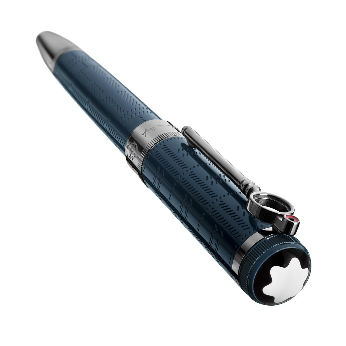 An up-close view showcases the Montblanc Writers Edition Sir Arthur Conan Doyle Limited Edition Fountain Pen, elegantly designed in dark blue with silver accents and adorned with a signature white star emblem on the cap. The pen boasts intricate patterns reflecting Sir Arthur Conan Doyle's era and includes a silver clip featuring a small loop. The backdrop is a plain white setting.