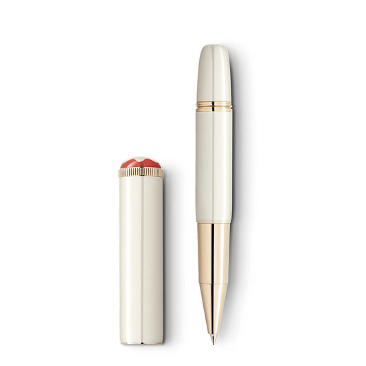 This elegant rollerball pen from the Montblanc Heritage Rouge et Noir Baby Special Edition features an ivory color with gold accents and a glossy finish. Its cap, highlighted by a distinctive design at the top, rests beside it against a white background—a true masterpiece among writing instruments.