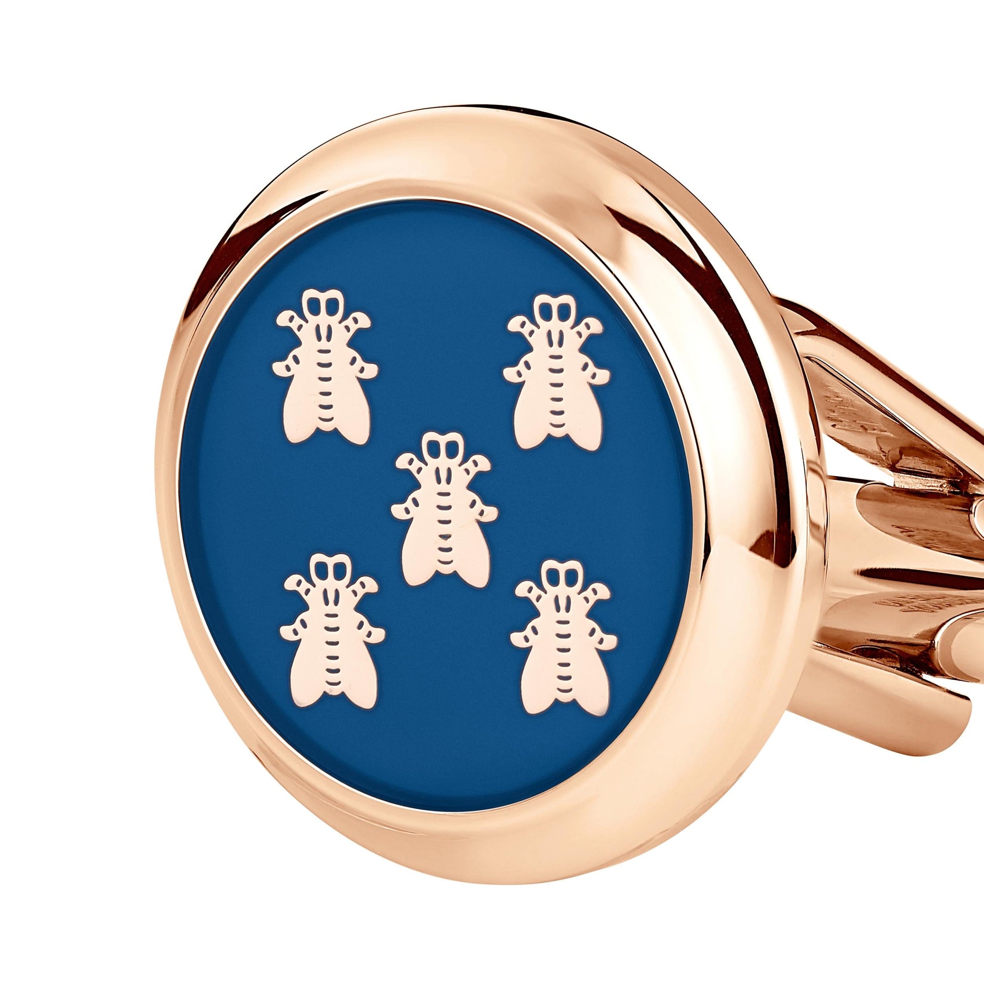 The Montblanc Cufflinks by Montblanc showcase a stainless steel base complemented by a round, blue enamel face featuring five symmetrically arranged gold bee motifs.
