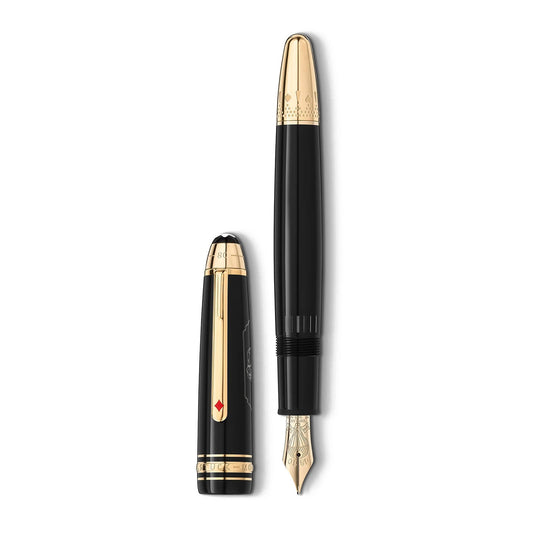 A stylish black Montblanc Meisterstück Around the World in 80 Days Legrand Fountain Pen with elegant gold accents is shown with its cap positioned beside it. The pen boasts intricate detailing on the nib and cap, showcasing a small red diamond-shaped design that echoes an adventure from "Around the World in 80 Days.
