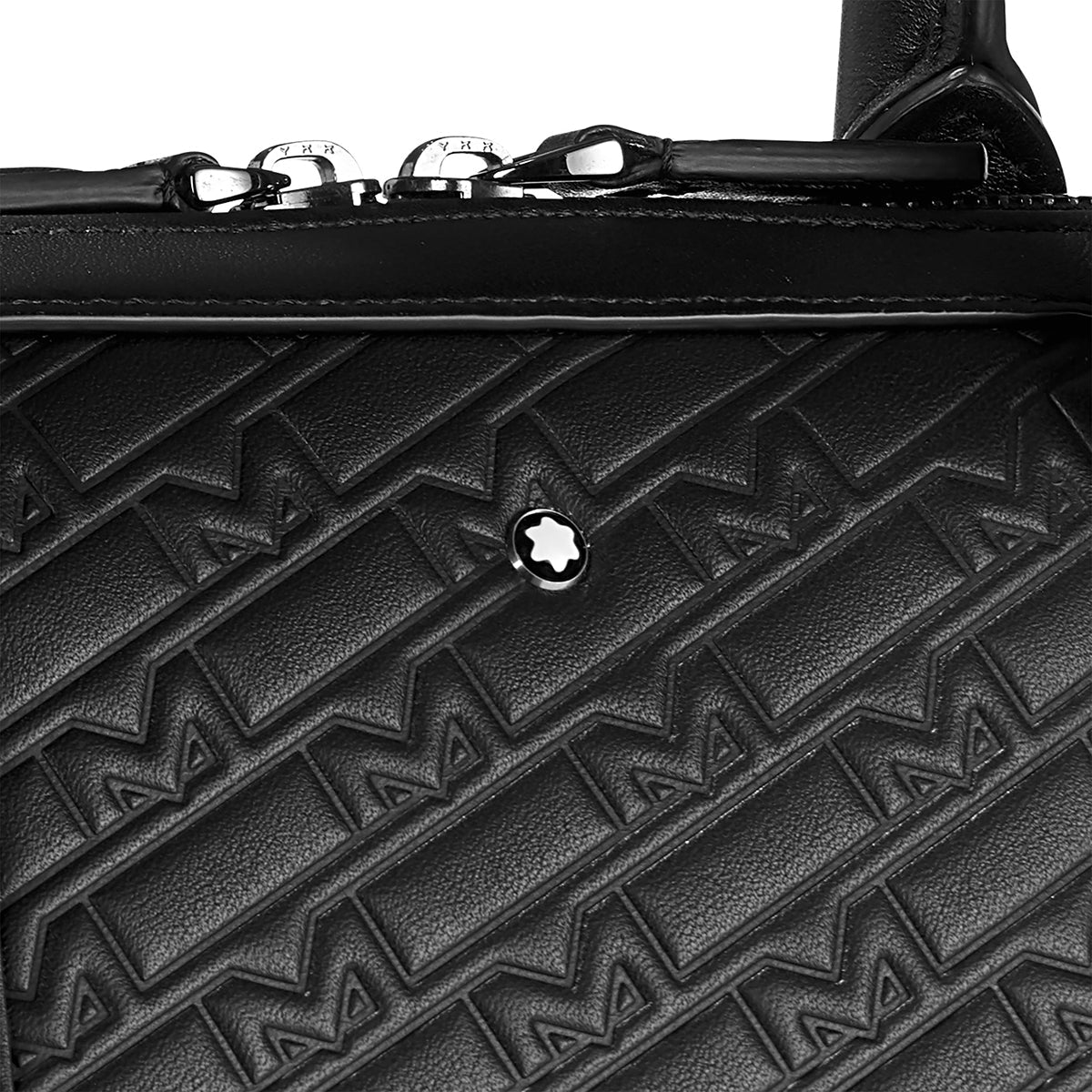 Close-up of the Montblanc M Gram 4810 Slim Black Leather Document Case, showcasing its textured pattern with raised M-shaped designs. This elegant piece features a shiny metal emblem at the center and prominent zippers along the top edge.