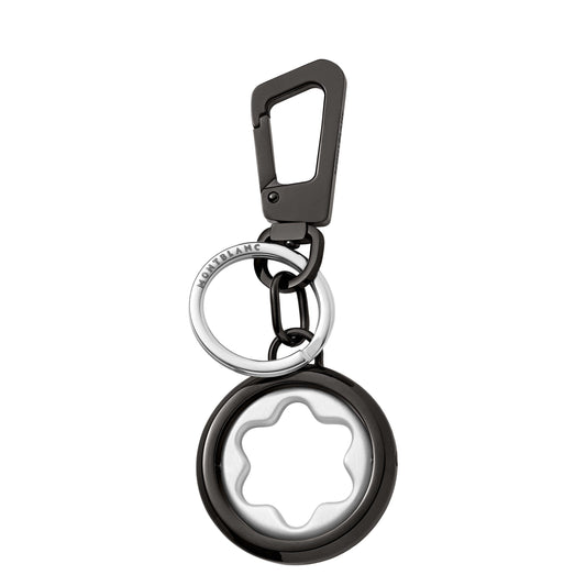 The Montblanc Meisterstuck Spinning Emblem Key Fob is a sleek metal keychain featuring a round spinning emblem with a star-like design. Attached to a sturdy clip and key ring, it beautifully showcases Montblanc's modern and elegant style.
