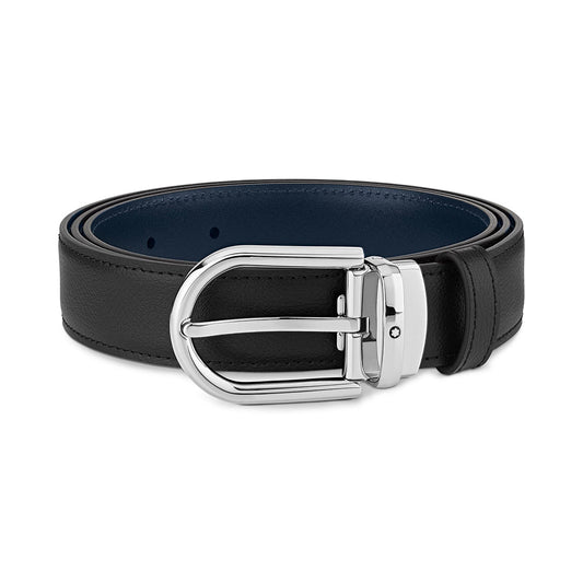The Montblanc Horseshoe Leather Belt is crafted from reversible leather and features a shiny silver buckle with a sleek palladium finish, elegantly coiled on a white background.
