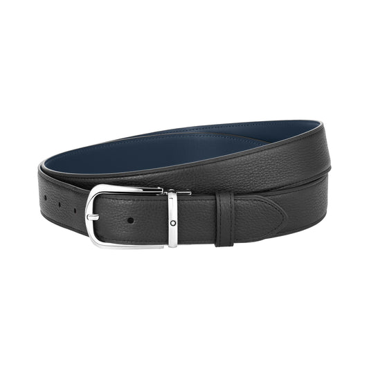 The Montblanc Reversible Leather Belt boasts a sophisticated black leather design complemented by a stainless steel pin buckle. It is coiled for display, presenting a smooth texture and featuring multiple adjustment holes, which accommodate various waist sizes.