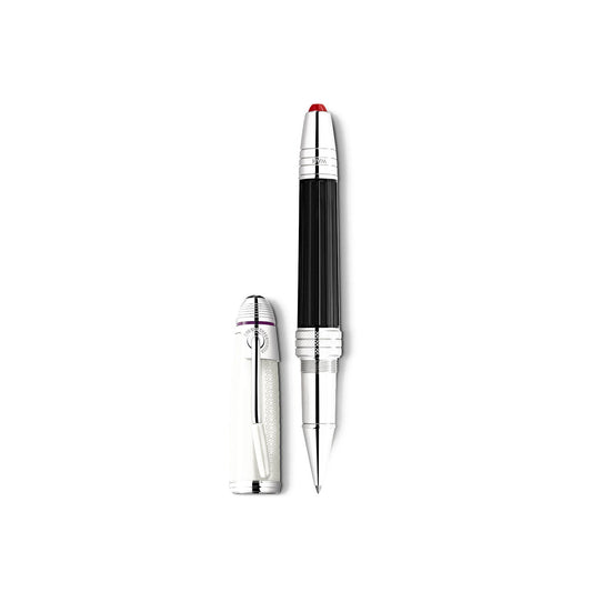 The Montblanc Great Characters Jimi Hendrix Special Edition Rollerball Pen, with its luxury black barrel and silver accents, stands elegantly on a plain white background. Its closed white cap, featuring a silver clip and red tip, is placed alongside it, evoking the image of an artist's electric guitar awaiting its next masterpiece.