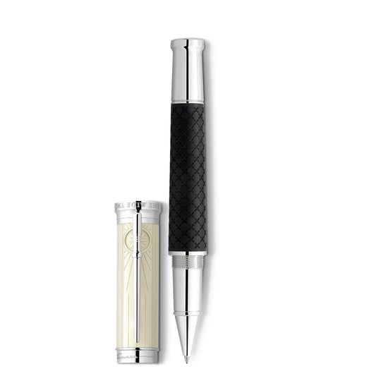 A Montblanc Writers Edition Homage to Robert Louis Stevenson Limited Edition rollerball pen with a silver and black textured body stands upright. The cap, resting beside it, features a silver finish with a smooth white panel that exudes an elegance reminiscent of Robert Louis Stevenson's timeless tales.