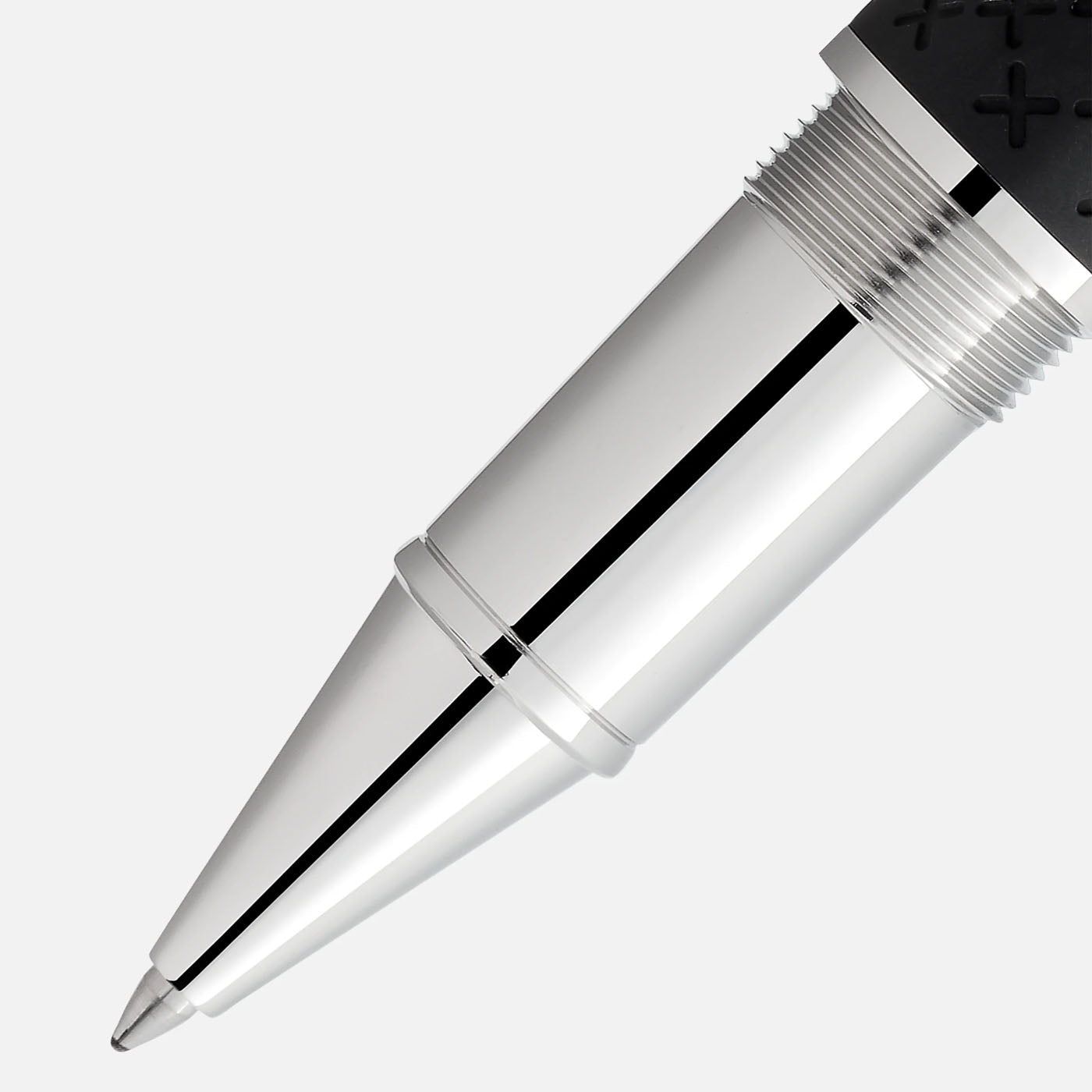 Close-up of a shiny silver pen tip with a black textured grip on the top section. The Montblanc Writers Edition Homage to Robert Louis Stevenson Limited Edition Rollerball Pen is set against a plain white background, highlighting its sleek and polished design.