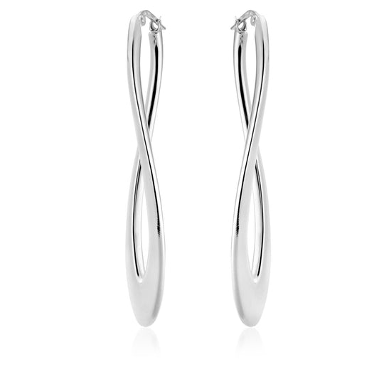 The Miss Mimi Sterling Silver Long Twist Hoop Earrings by Miss Mimi, crafted in Italy, are showcased against a white backdrop. These polished earrings boast an elegant, elongated infinity shape.