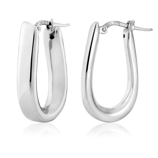 A pair of Miss Mimi Sterling Silver Hoop Earrings by Miss Mimi by Yael are showcased on a white background. Crafted in Italy, these earrings feature a modern, curved design with hinged latch backs that reflect light off their smooth, shiny surfaces.