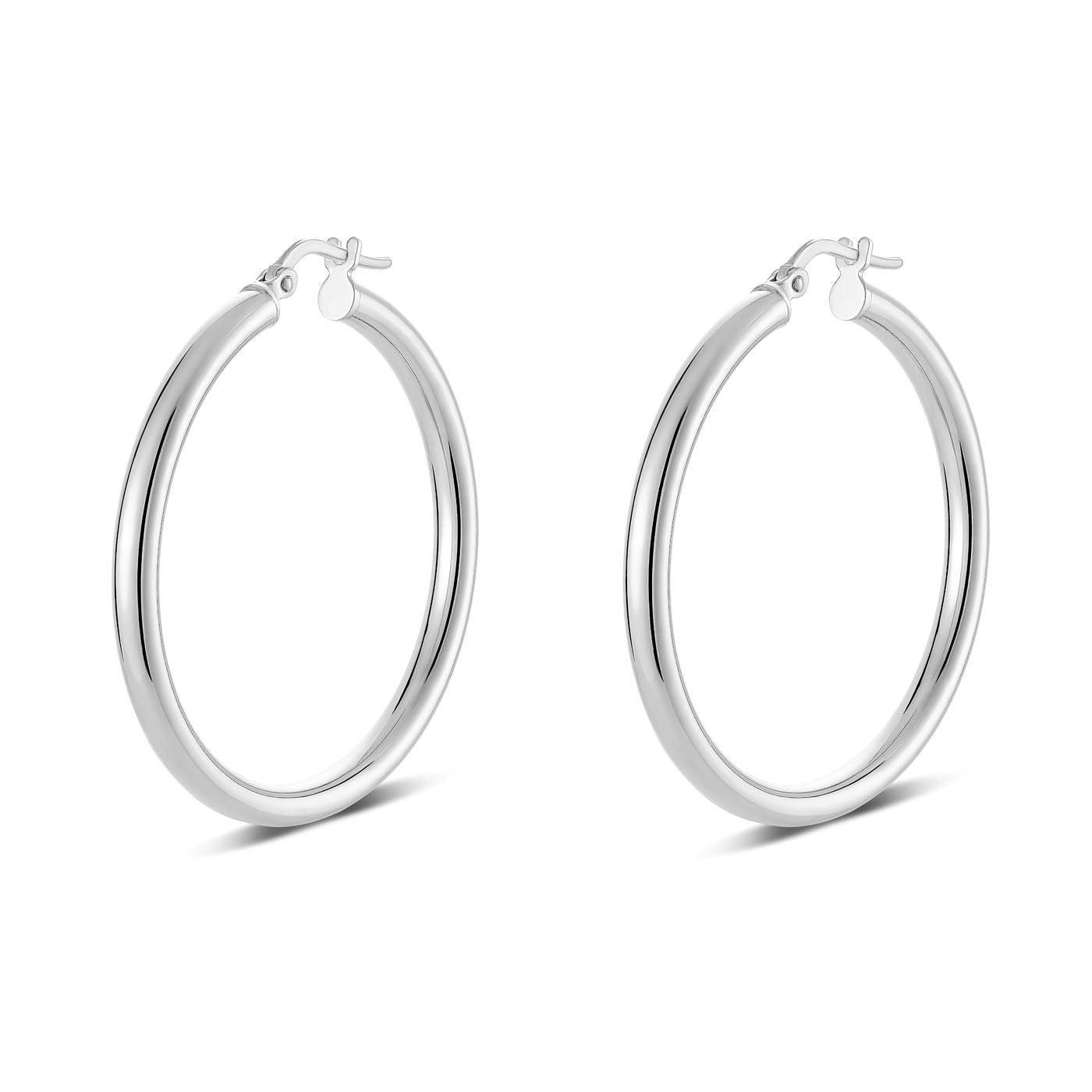 Here's a revised version of the sentence using the provided product data:

A pair of Miss Mimi by Yael Sterling Silver Medium Round Tube Hoop Earrings, featuring a sleek and smooth design crafted from high-quality Sterling Silver. Each earring has a hinged closure, measures 35mm in diameter, and is positioned upright against a white background to highlight their circular shape and lustrous metallic finish.