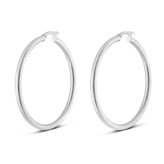 Displayed on a white background, the Miss Mimi Sterling Silver Large Round Tube Hoop Earrings by Yael feature a 45mm outer diameter. These perfectly round earrings have a smooth, shiny finish with rhodium bonding and are equipped with a simple clasp mechanism at the top.