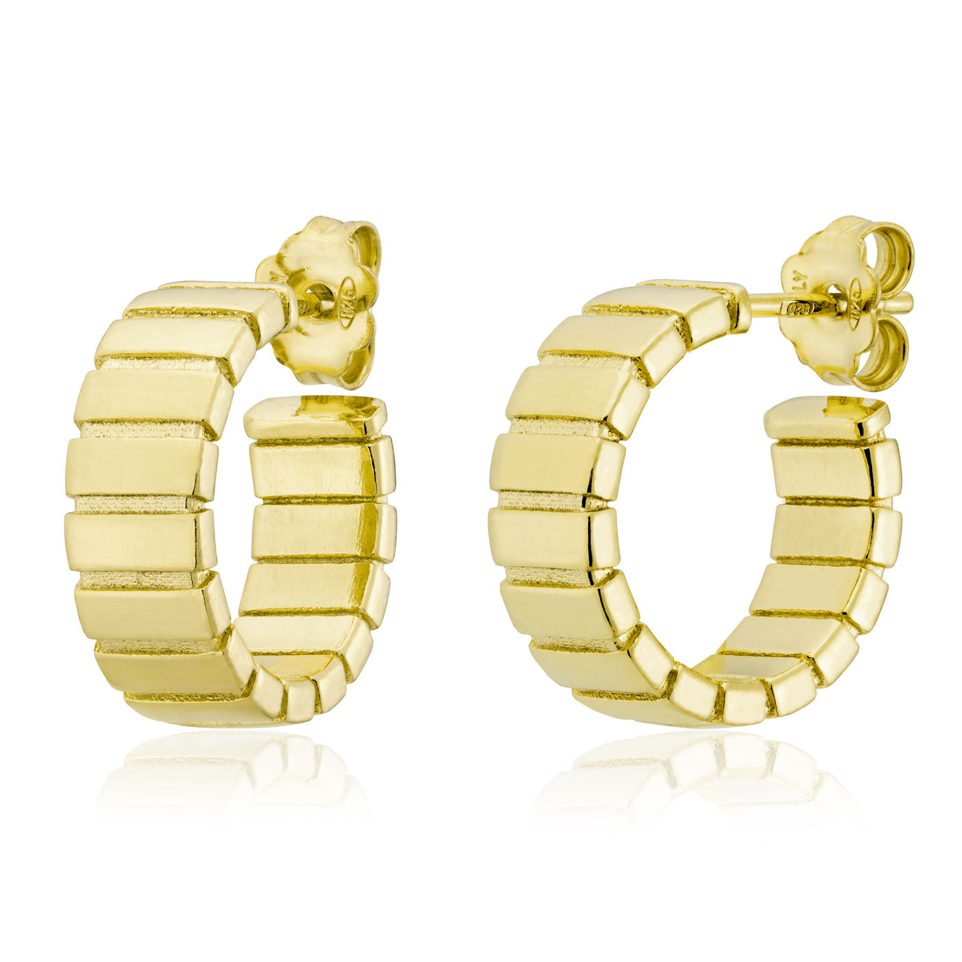 Introducing the Miss Mimi 18K Yellow Gold Vermeil and Sterling Silver Grooved Hoop Earrings by Miss Mimi by Yael. These earrings showcase a segmented, geometric design with a lustrous finish that reflects beautifully when positioned side by side. Expertly crafted in Italy, they offer an exquisite blend of elegance and contemporary style.