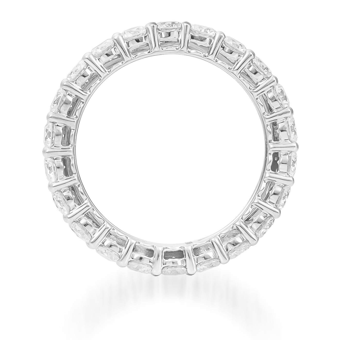 A circular Raffi&Co.® 18K White Gold Fashion Ring features embedded rectangular diamonds all around, forming a continuous sparkling loop. The smooth inner and outer surfaces accentuate the brilliance of the baguette-cut gems, showcasing Raffi&Co.'s impeccable craftsmanship against a white seamless background.