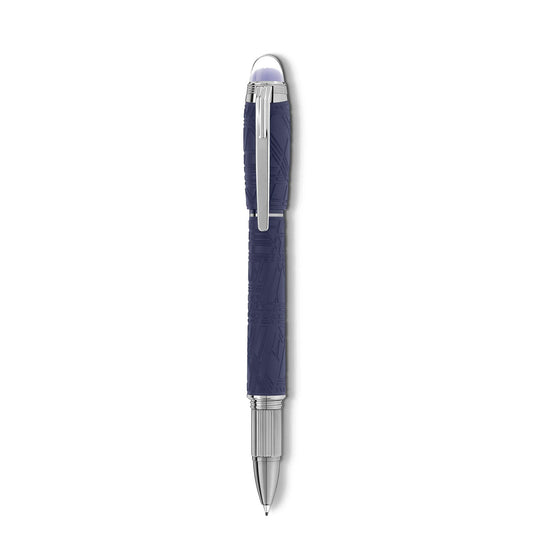 The Montblanc Starwalker SpaceBlue Resin Fineliner Pen features a textured navy barrel inspired by the Widmanstätten Pattern, complemented by a sleek silver clip and tip, creating a futuristic look. The pen stands elegantly vertical against a crisp white background.