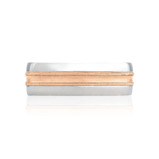 A Tacori Classic Two-Tone Finish 18K White and Rose Gold Classic Wedding Band is elegantly displayed on a white surface, catching the light. The contemporary and refined design, highlighted by its contrasting colors, underscores the dual-metal craftsmanship.