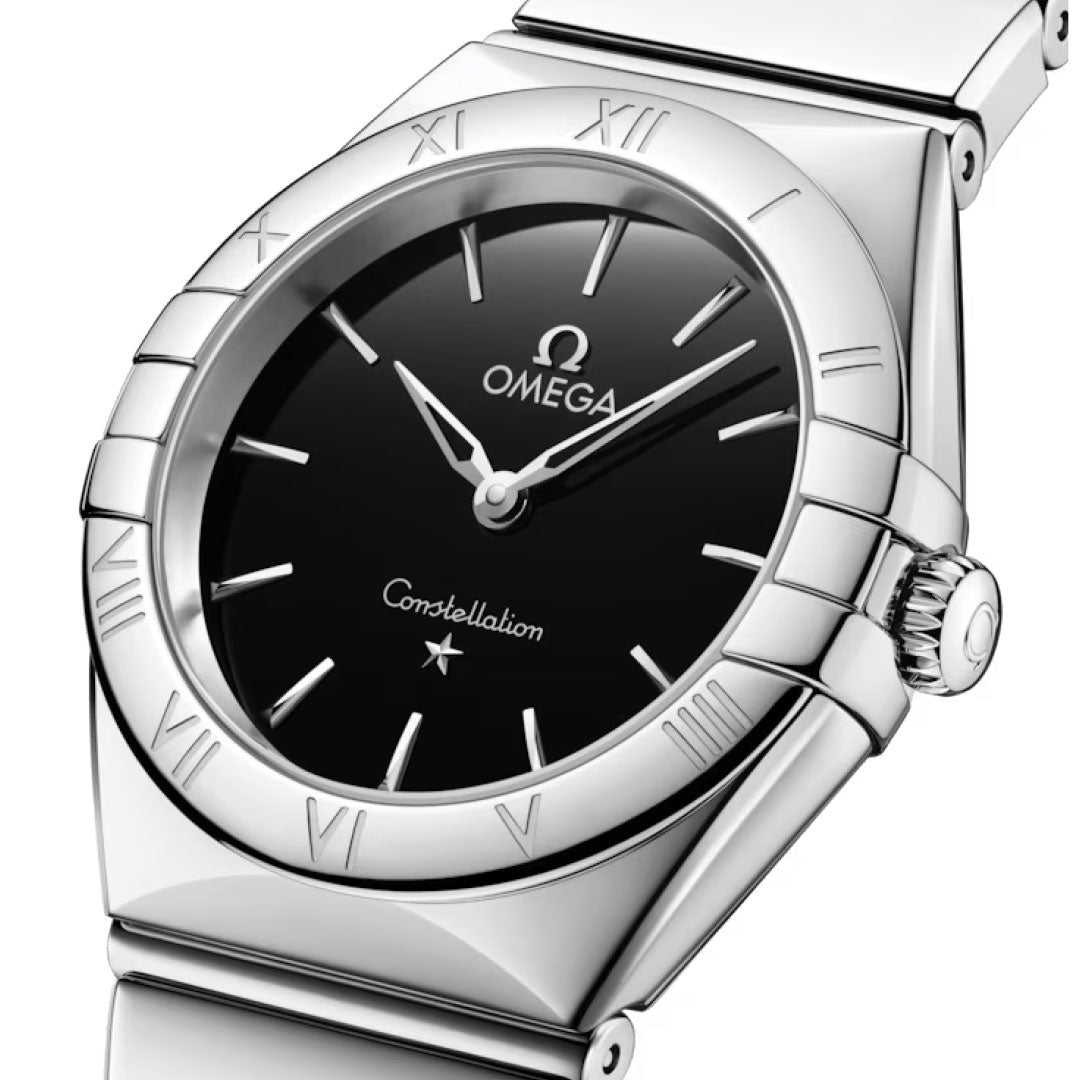 A close-up of the OMEGA Constellation Quartz 28mm Watch, featuring a black dial, silver Roman numerals on the bezel, silver hands, and a polished stainless steel bracelet for an elegant ladies’ look.
