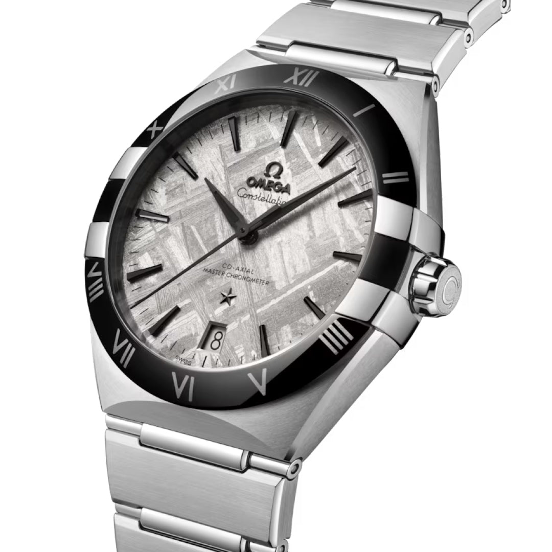 A close-up of the OMEGA Constellation Co-Axial Master Chronometer 41mm, showing its meteorite dial, silver and black Roman numeral bezel, stainless steel bracelet, date at 6 o'clock, and advanced Calibre 8900 movement.