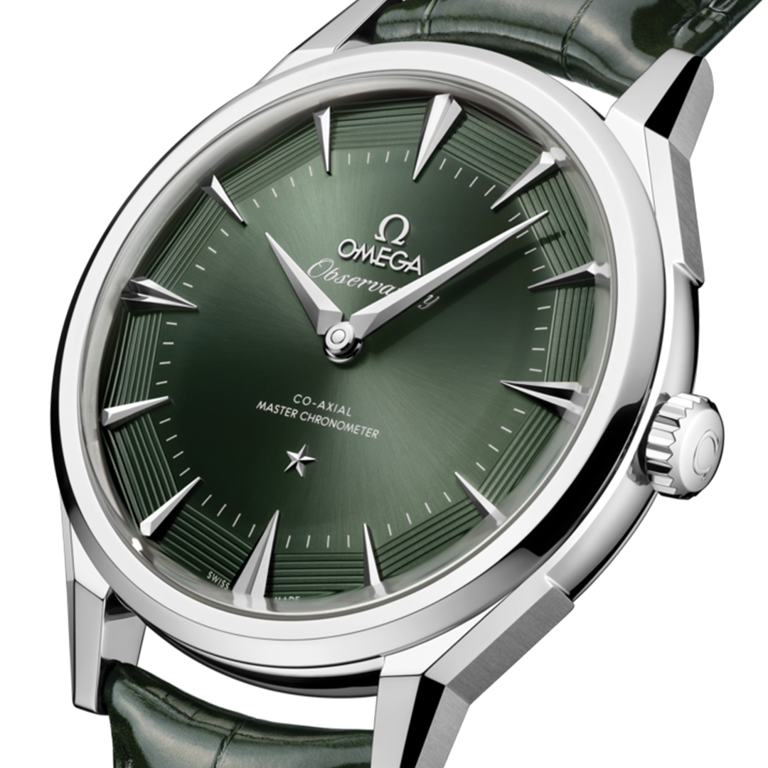 An OMEGA Constellation Observatory Co-Axial Master Chronometer 39.4mm Watch with a silver finish, a dark green sun-brushed dial with a grooved outer ring and small silver star, and a dark green leather strap.