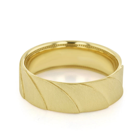 The Tacori Geometric Crescent Satin Finish 18K Yellow Gold Men's Wedding Band is showcased against a white background, highlighting its matte finish and elegant diagonal swirl pattern reminiscent of a crescent wave. The interior of the band features a polished, smooth surface.