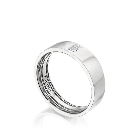 The Tacori High Polish Finish Platinum Emerald Bezel Set Diamond Wedding Band features a sleek design with a rectangular, clear gemstone elegantly positioned on its smooth band. The ring showcases intricate detailing and Tacori's signature sculpted crescent design, enhanced by a comfort fit structure, beautifully displayed against a white background.