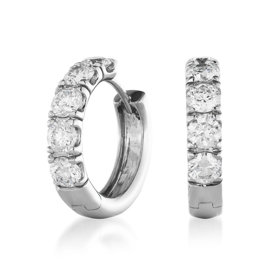 Introducing the Raffi&Co.® 18K White Gold Diamond Hoop Earrings, crafted by Raffi&Co. These elegant hoops feature five sparkling round diamonds on each earring, all set in luxurious 18K white gold. The polished finish underscores their exquisite design and craftsmanship.