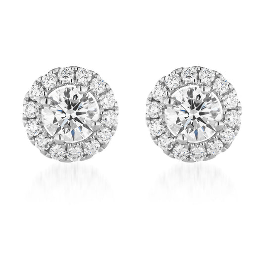 A pair of Raffi&Co.® 18K White Gold Diamond Stud Earrings, each featuring a large central diamond surrounded by a halo of smaller diamonds, displayed on a plain white background.